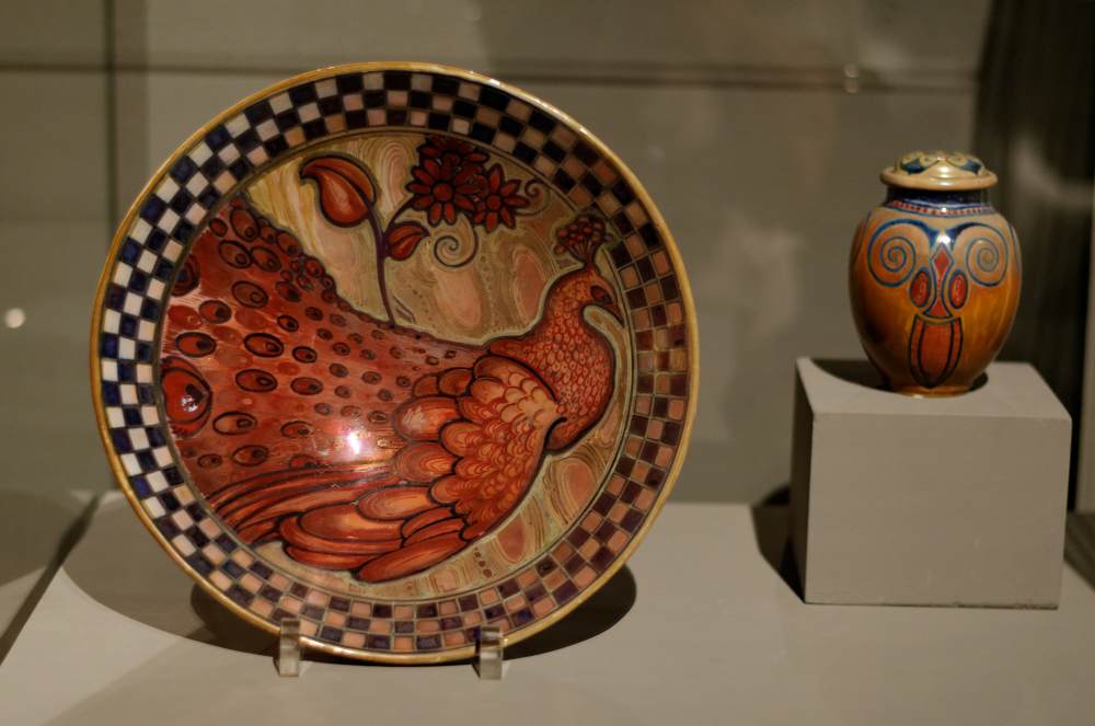 Decorative plate with peacock and lidded vessel by