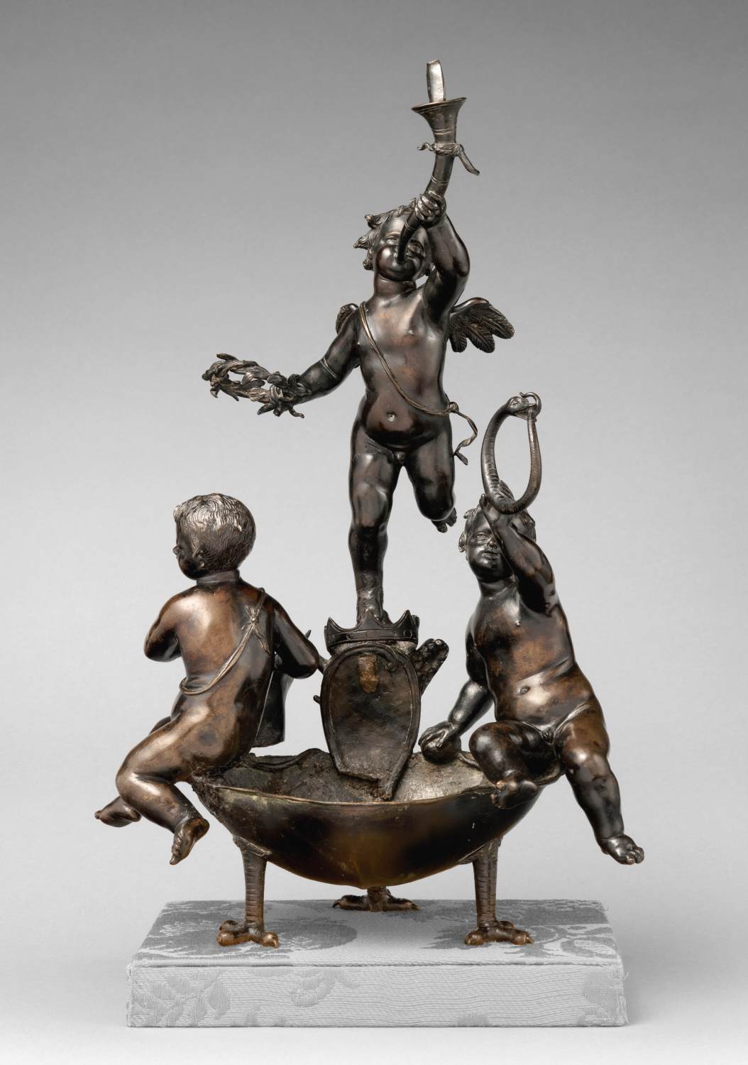 Vessel with three putti by